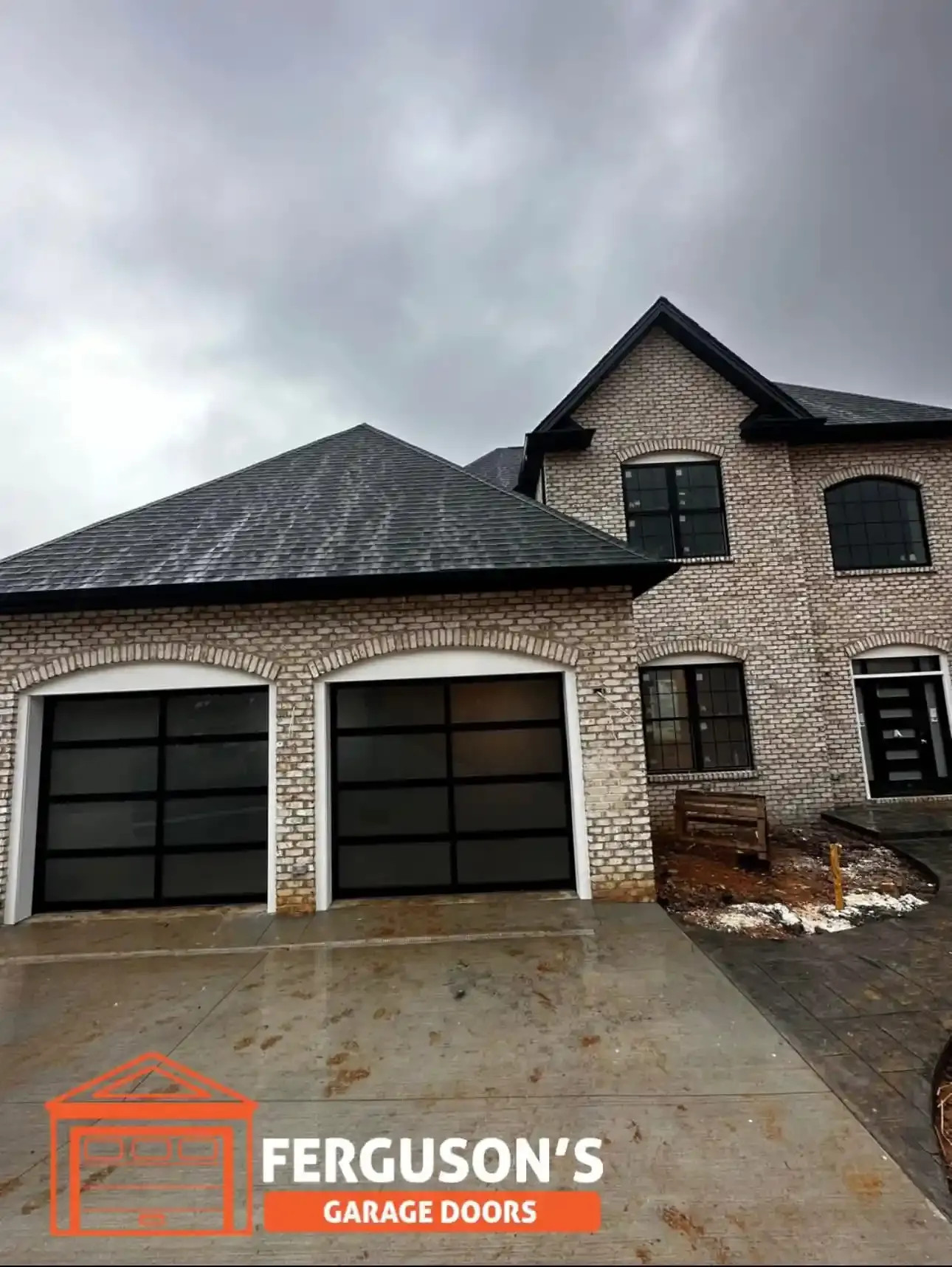 Full-view glass doors on brick home